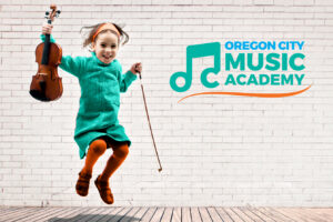 Portrait of cute little girl jumping violin